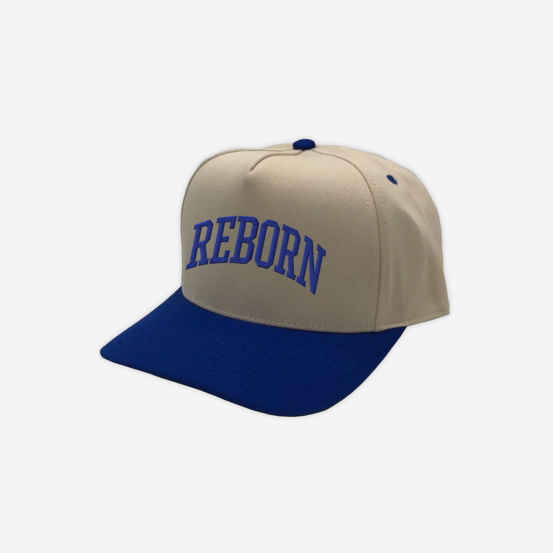 "REBORN" trucker hat in Royal Blue