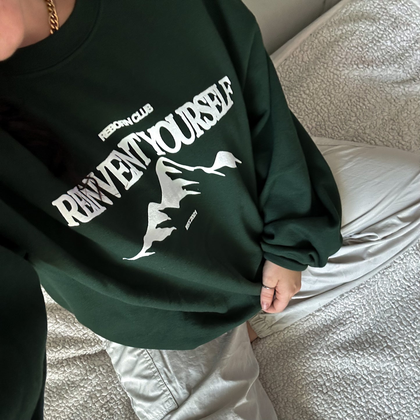 'REINVENT' crew in forest green