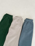 'REINVENT' SWEATS IN DEEP GREEN