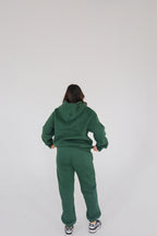 'REINVENT' SWEATS IN DEEP GREEN