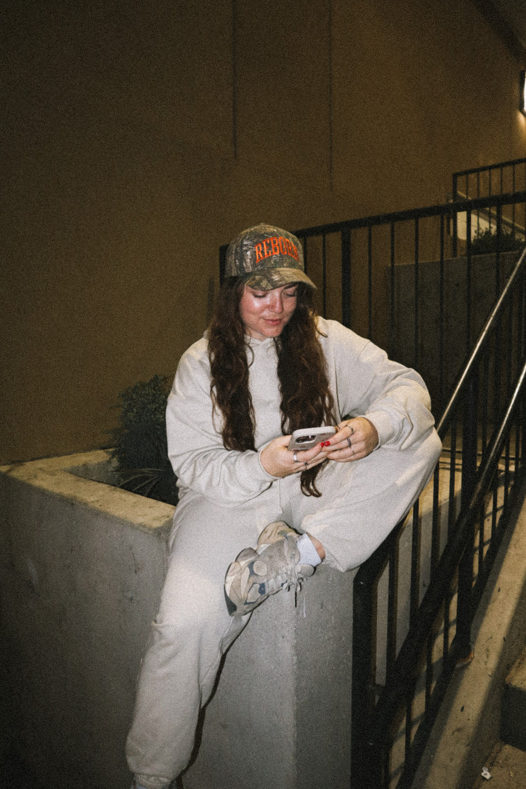 "REBORN" HAT IN ORANGE CAMO