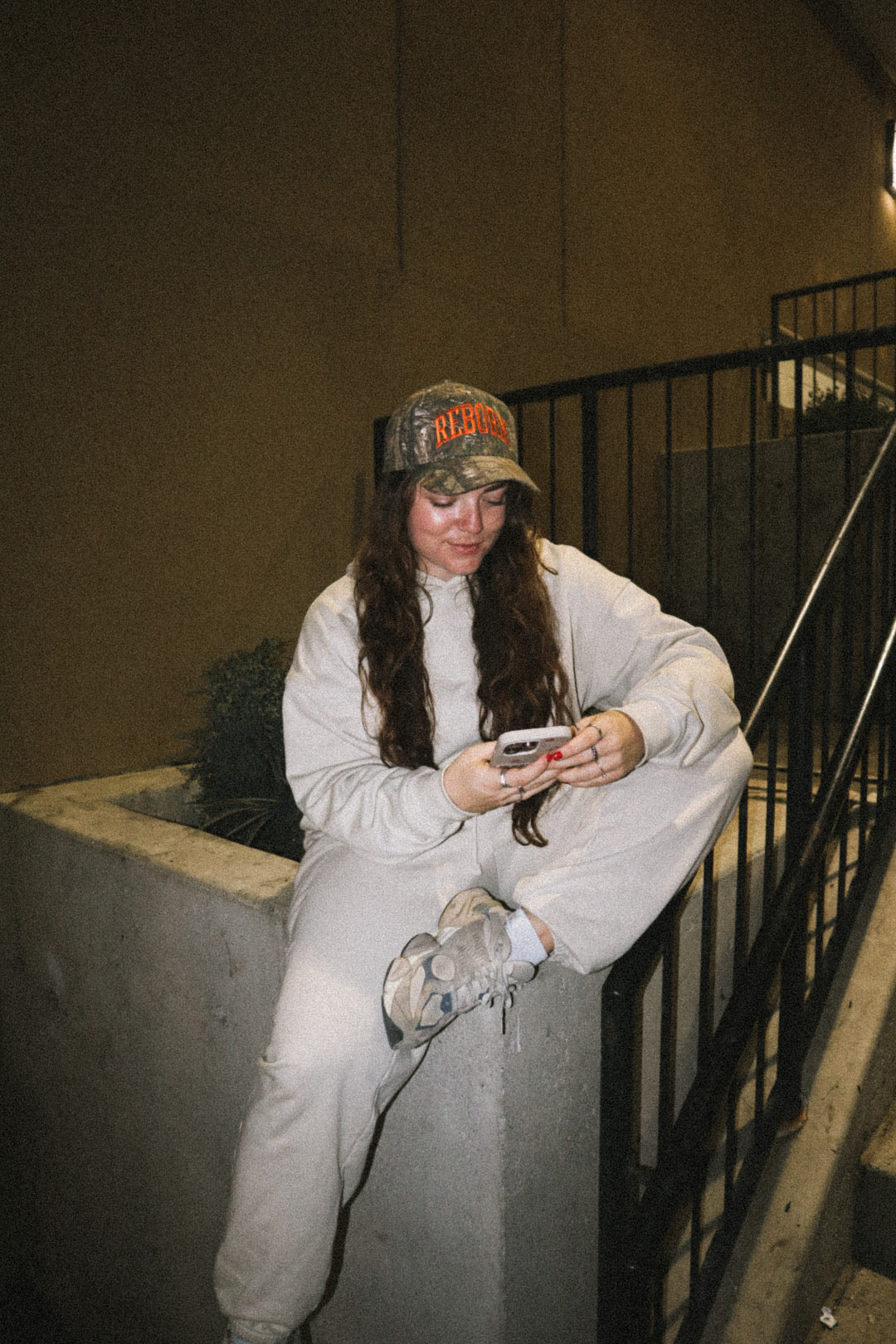 "REBORN" HAT IN ORANGE CAMO