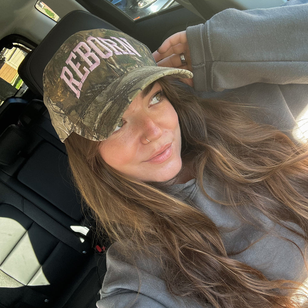 "REBORN" CAP IN PINK CAMO