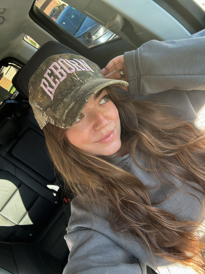 "REBORN" trucker hat in Pink Camo