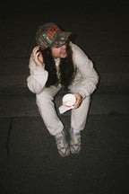 "REBORN" HAT IN ORANGE CAMO