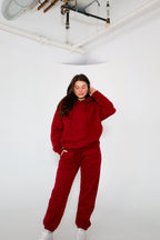 'REINVENT' HOODIE IN CRANBERRY