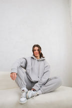 'REINVENT' HOODIE IN STONE