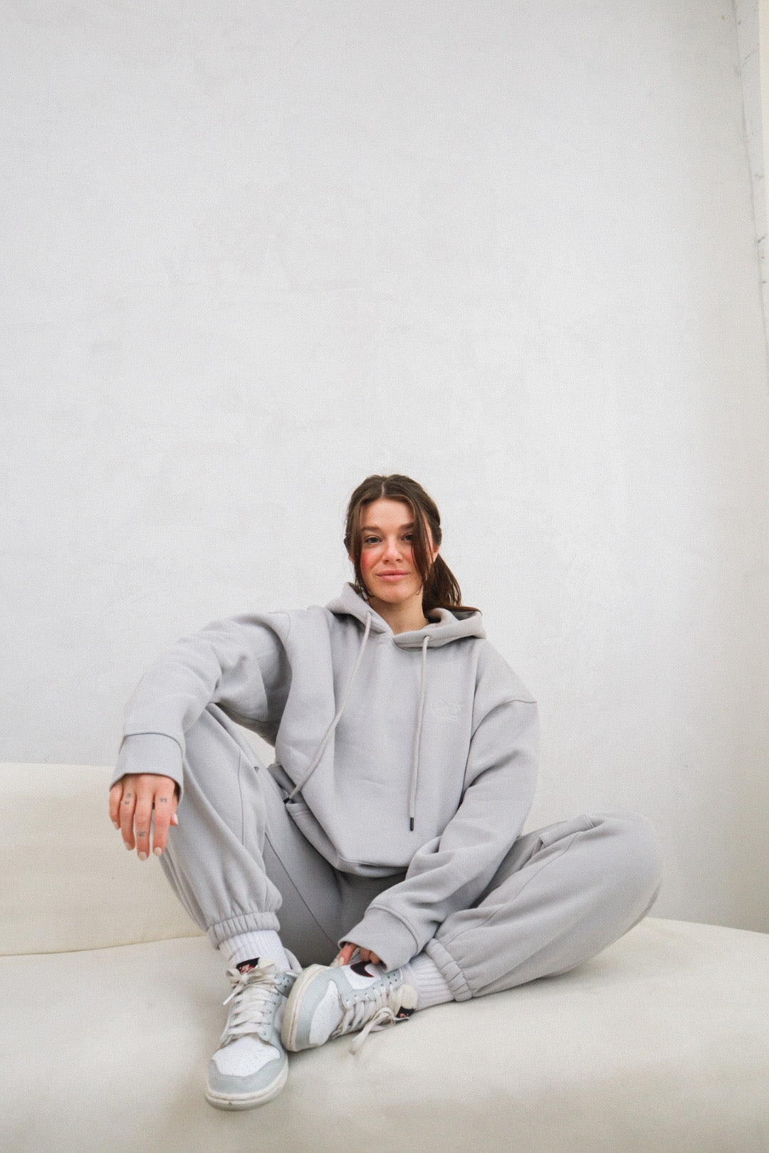 'REINVENT' HOODIE IN STONE