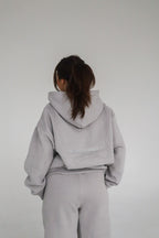 'REINVENT' HOODIE IN STONE