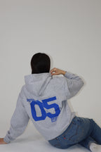 'THE BECOMING' HOODIE IN GREY