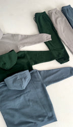 'REINVENT' HOODIE IN STONE